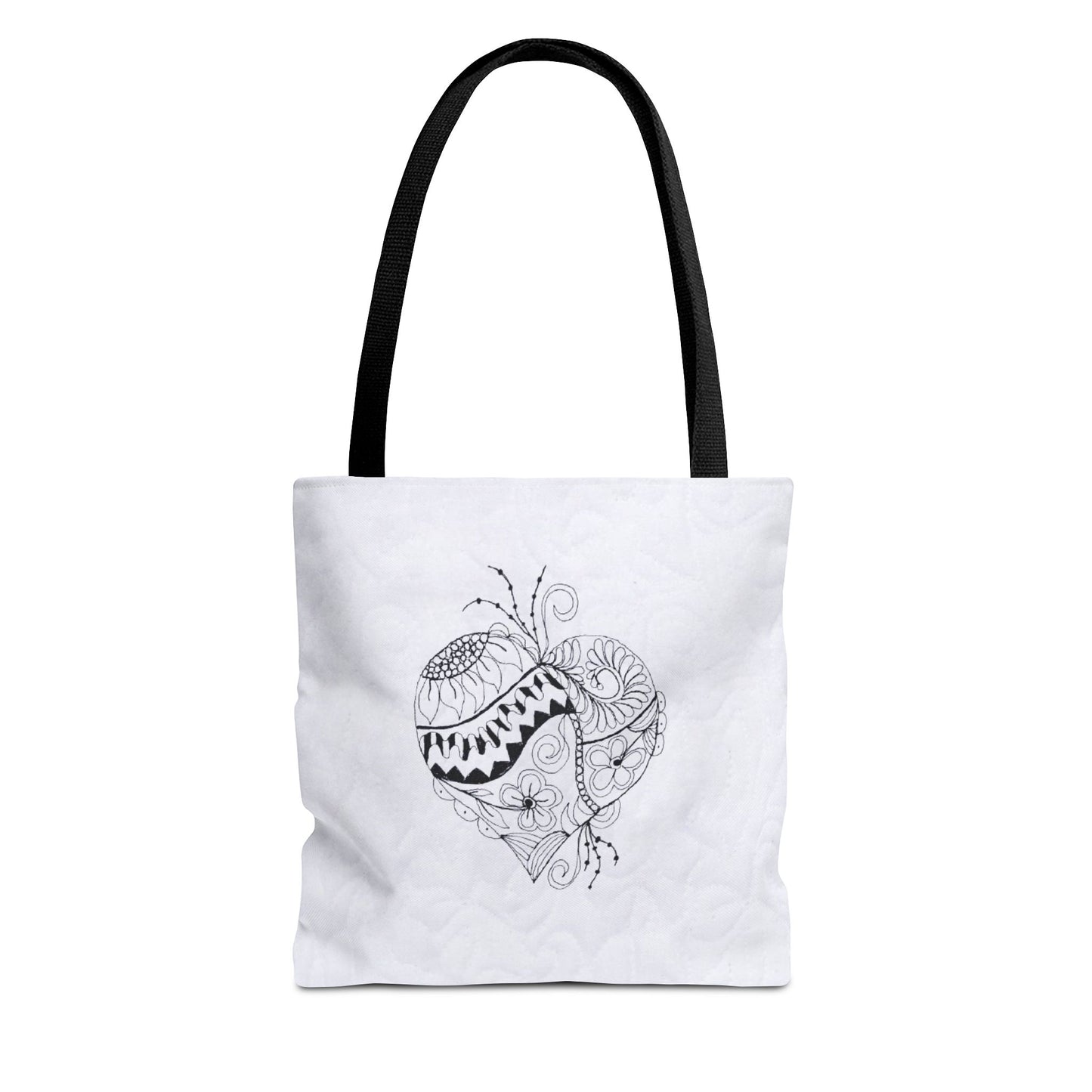 White tote bag with black heart design on a white background