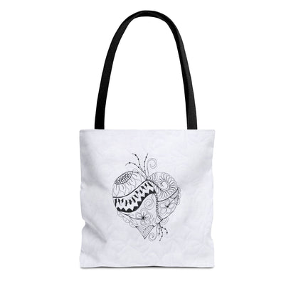 White tote bag with black heart design on a white background