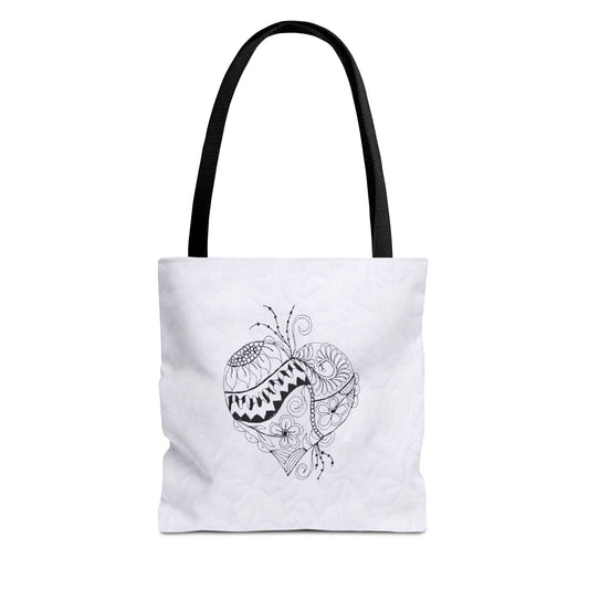White tote bag with black heart design on a white background