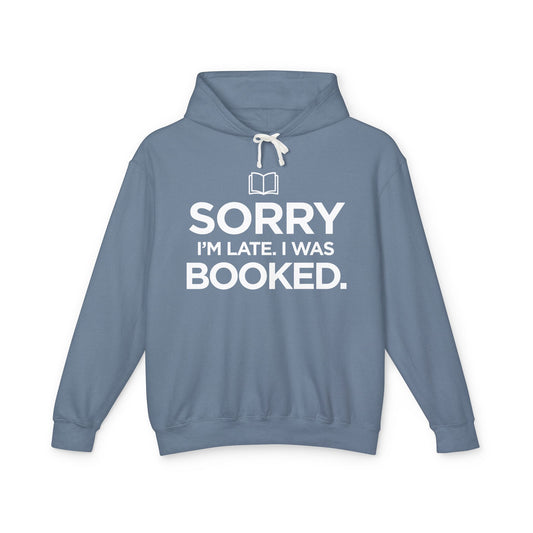 Blue hoodie with 'Sorry I'm late. I was booked.' in white text 