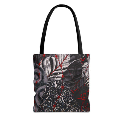 Tote bag with black handle featuring a black and white abstract design with red accents 