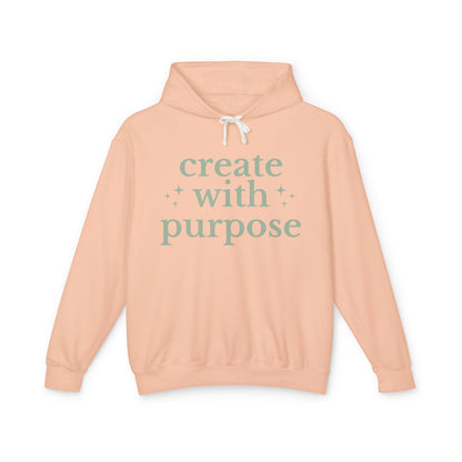 Peach hoodie with 'create with purpose' text 