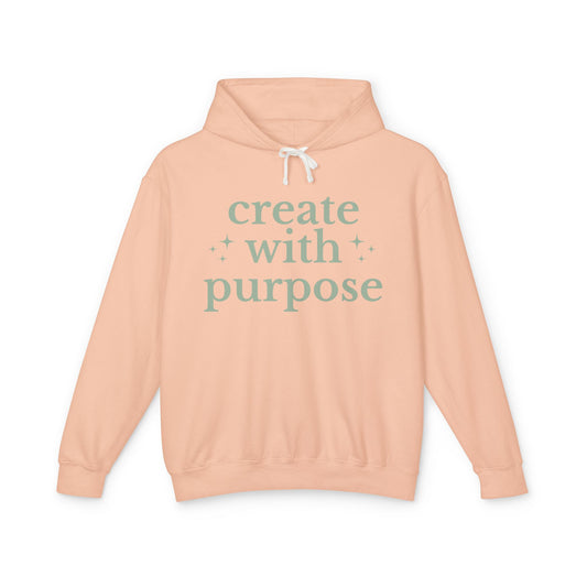Peach hoodie with 'create with purpose' text 