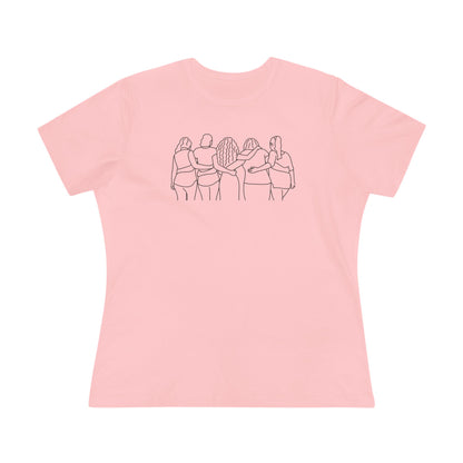 Pink t-shirt with a black line graphic of five women with different hair styles linking arms on a pink background