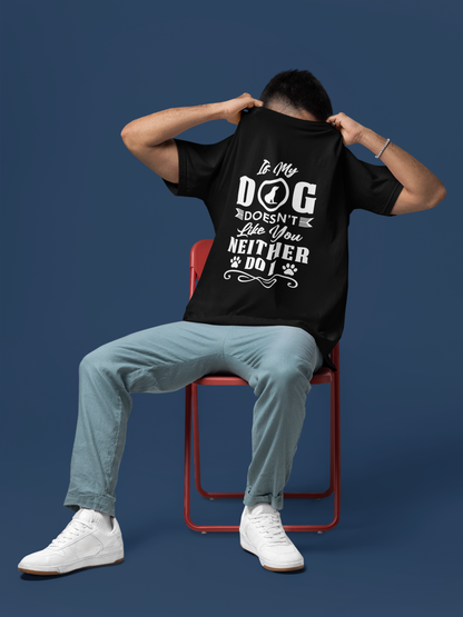 Person wearing a black t-shirt with a humorous dog-themed design that says "If My Dog Doesn't Like You, Neither do I" sitting on a red chair 