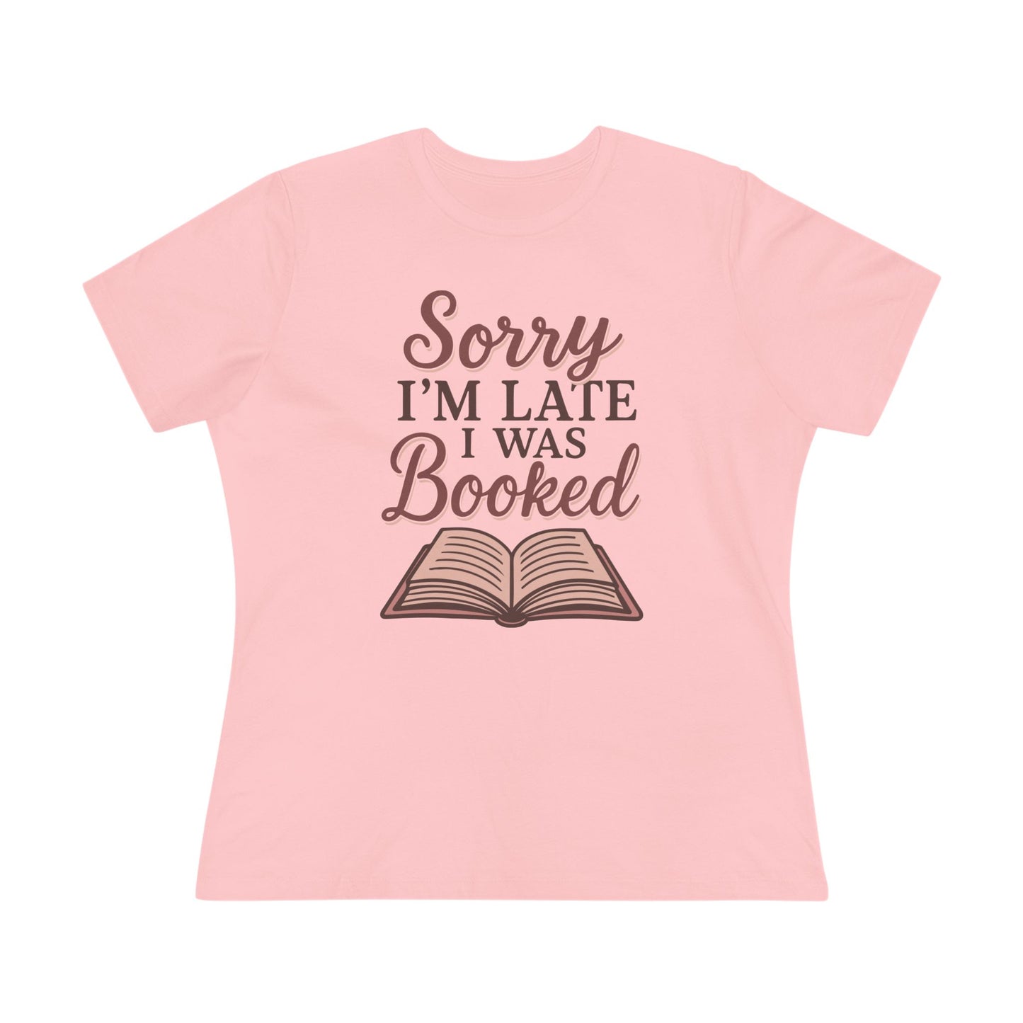 Pink t-shirt with 'Sorry I'm Late I Was Booked' text and book graphic 