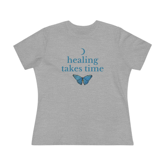 Gray t-shirt with 'healing takes time' blue text and butterfly graphic on a white background