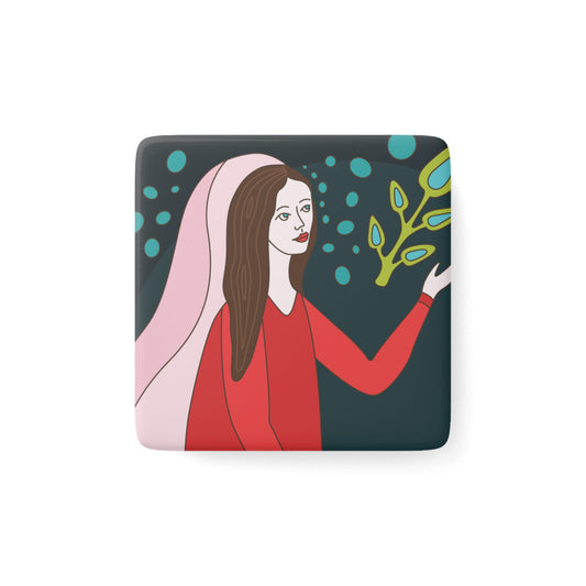 Square magnet with a colorful illustration of a woman holding a plant on a dark background