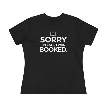 Black t-shirt with white text 'Sorry I'm late. I was booked.' 