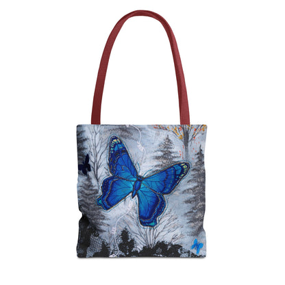 Tote bag with a blue butterfly design and red handle on a white background